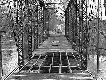 Looking Glass River, Monroe Road.  Built in 1894, this 148 foot structure is one of the longest Pratt through truss bridges in Michigan.